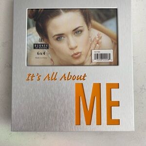 Brushed silver-colored 7.5”x8.5” frame w/ 5.5”x3.5”photo opening w/ message